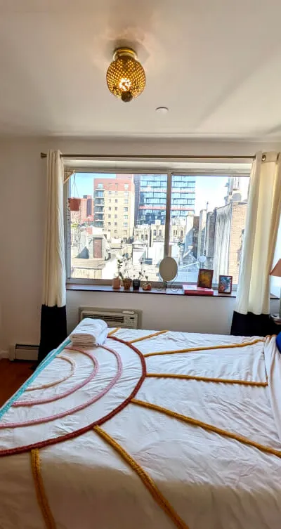 Colorful Furnished LES 2bd apartment w/ balcony, w/d, elevator & more!