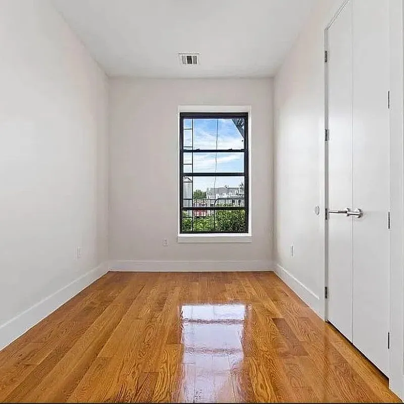 Furnished Bedroom in 3-Bedroom Bed-Stuy Apartment