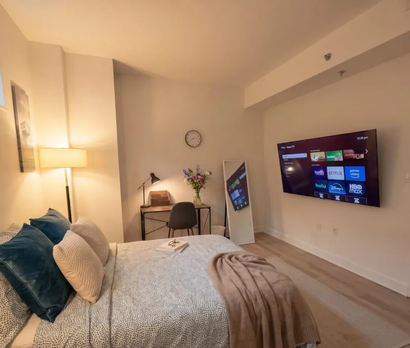 Cozy, Fully Furnished Room with Dedicated Workspace & Warm Ambient Lighting